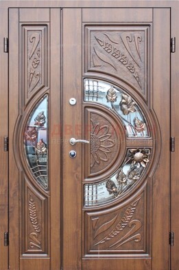 Уличная дверь в цвете Итальянский орех с виноритом и ковкой со стеклом ДВТ-147 в Нижнем Новгороде